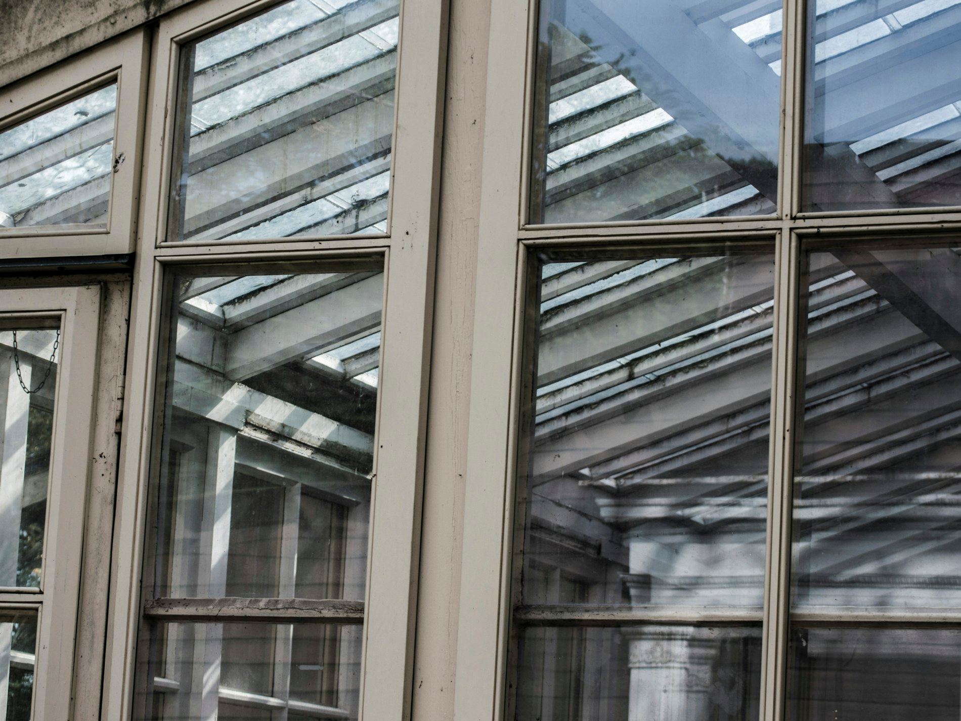 Close-up of a wooden framed glass roof structure.